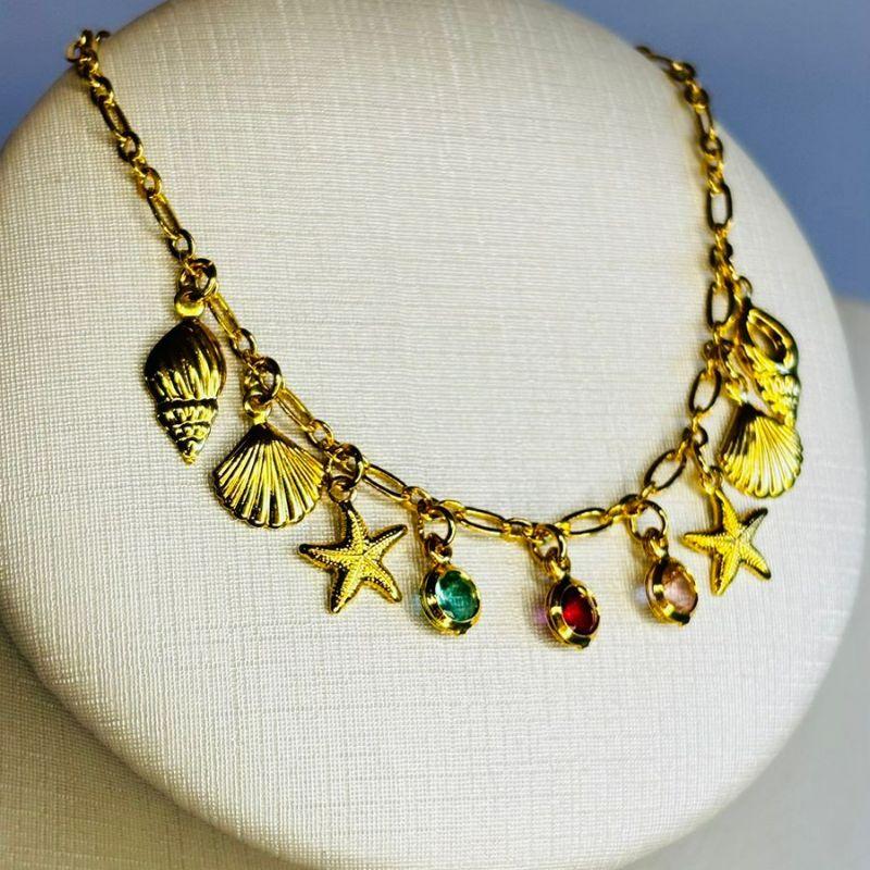 Pulseira conchas e estrelas do mar com zircônias coloridas